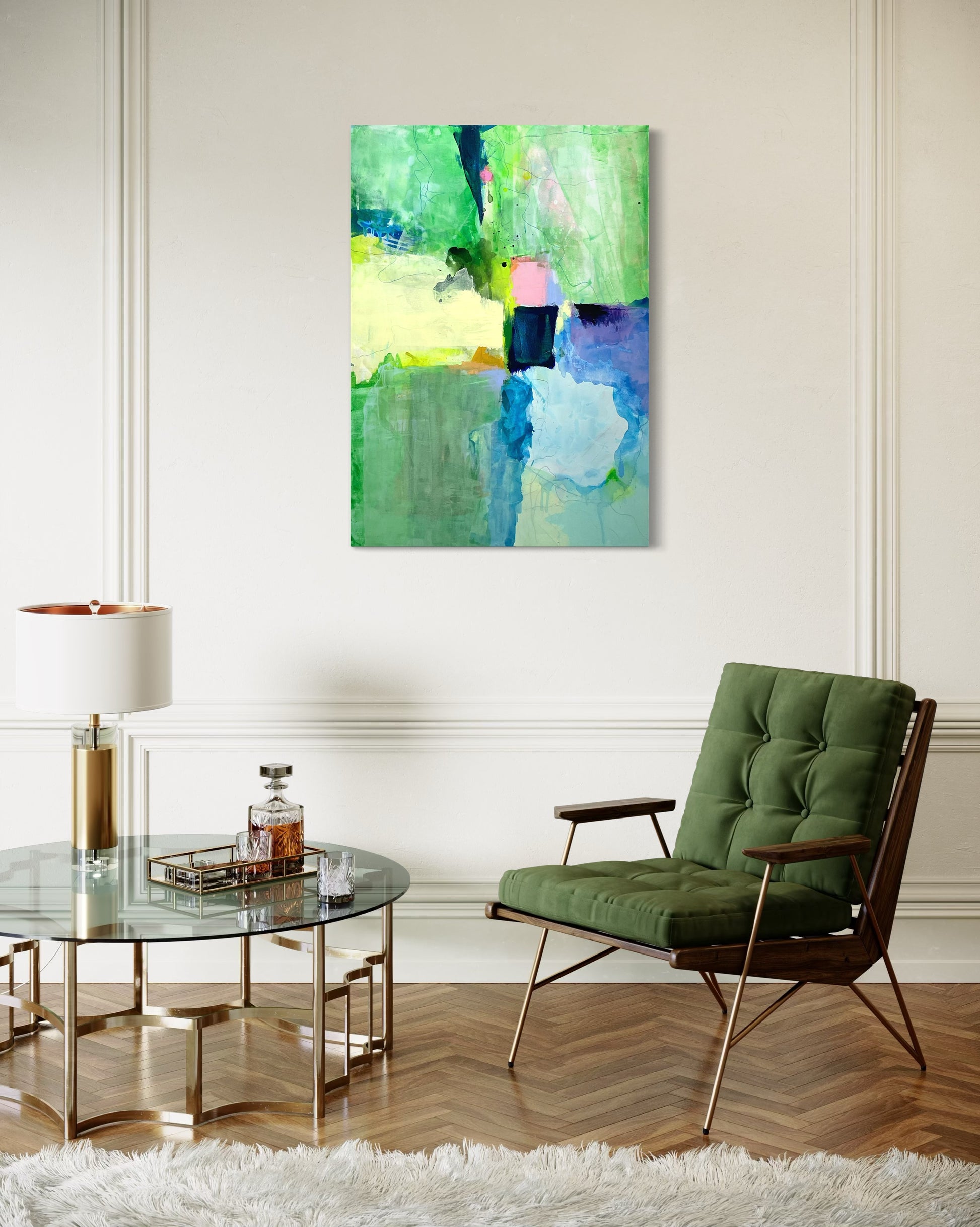 Modern living room with a green chair, glass table, and abstract painting on the wall.