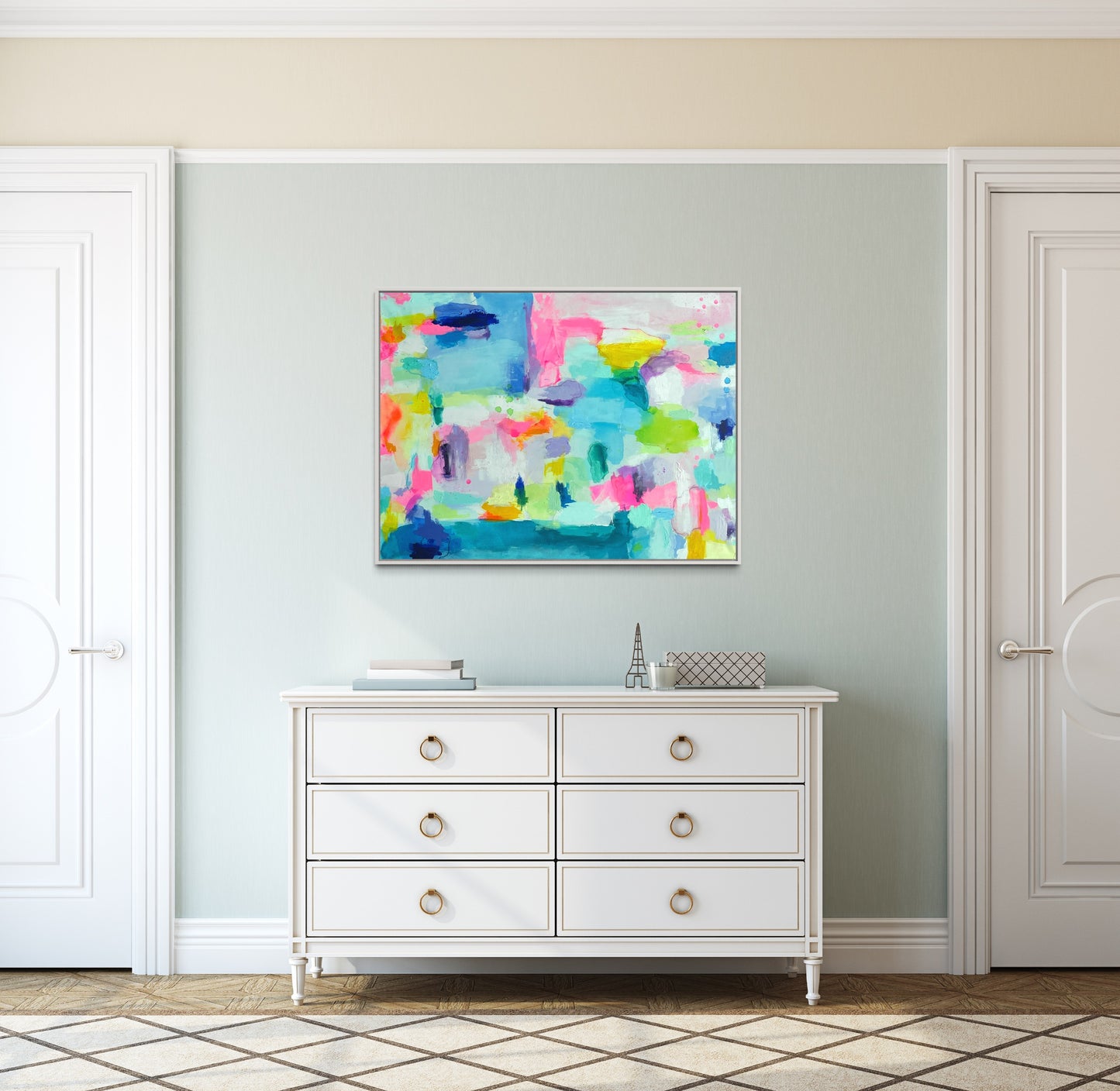 The Dolly Original Abstract Painting by Sarah Henry as part of the Happy Art Collection, hanging on a pale blue wall above a six drawer white dresser in a grand millennial or coastal design scheme bedroom.
