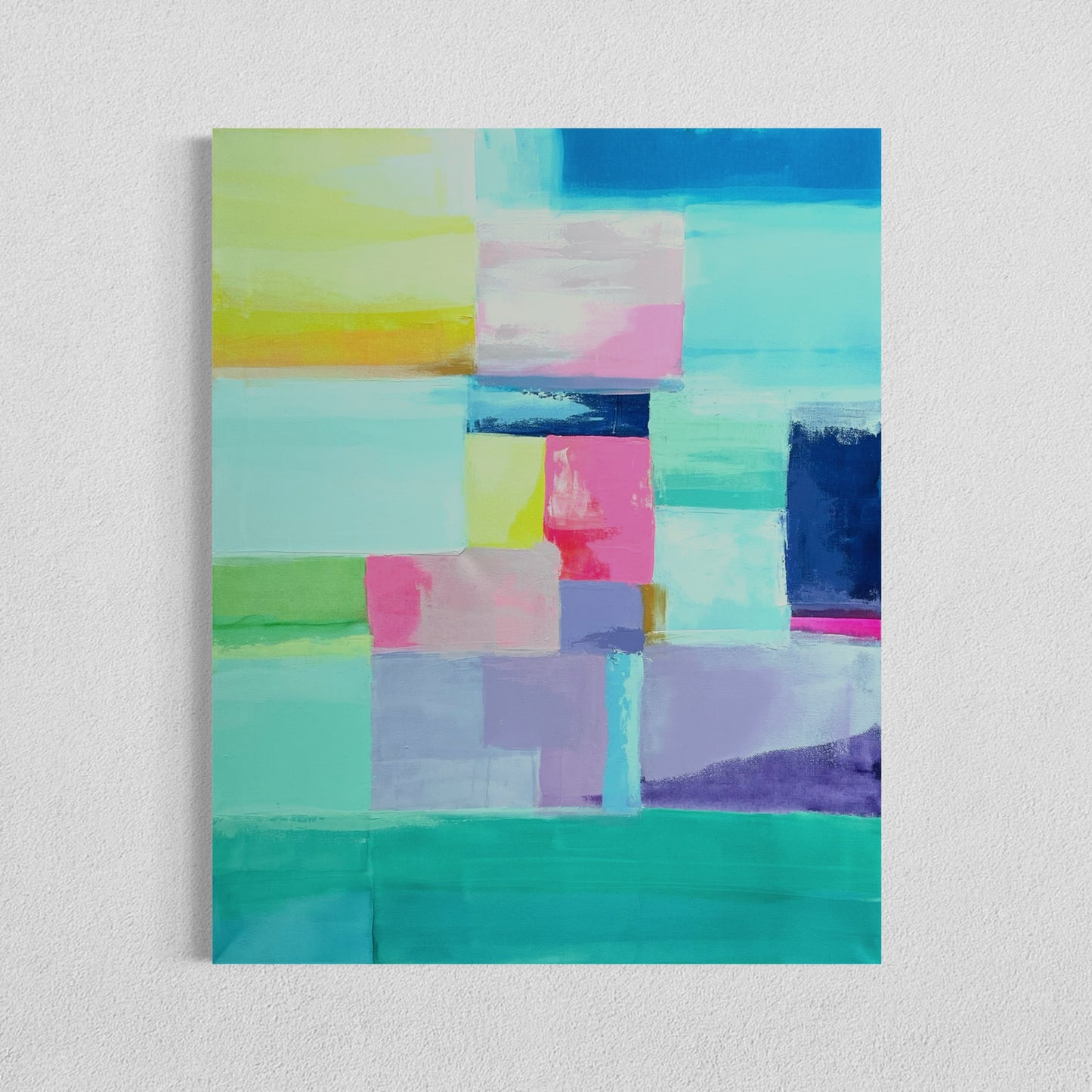 A colorful abstract expressionist painting featuring various geometric shapes in shades of blue, pink, and purple on a white background, framed in a light color.