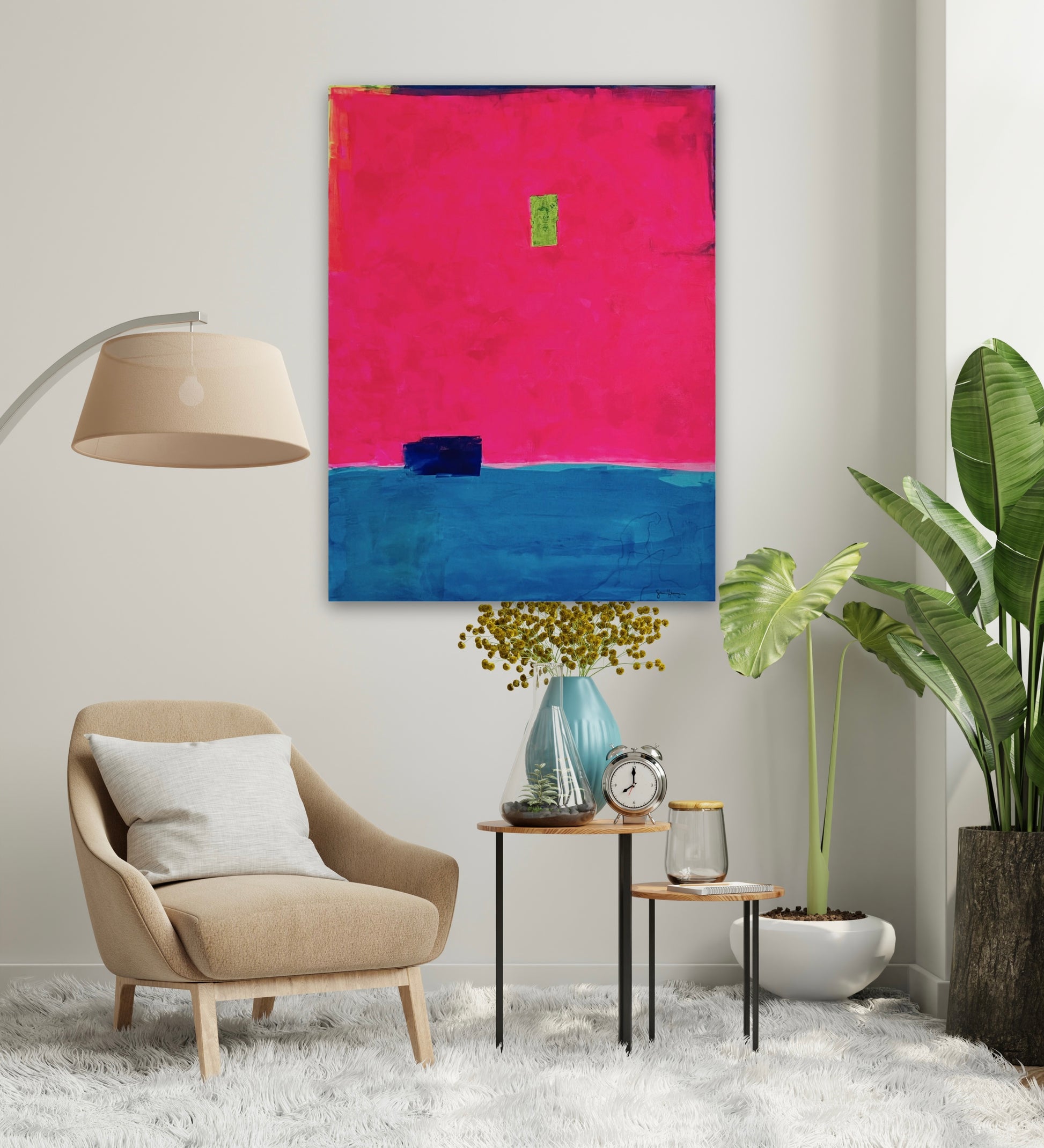Oversized large abstract art features a bold composition of vibrant fuchsia pink occupying the upper portion and deep blue in the lower section. A small, ultramarine blue rectangular shape sits near the dividing line, while a tiny neon green rectangle is positioned slightly above the center. Along the top, the fluorescent pink stops short of the edge of the canvas, showing a small border of blue, purple, and neon yellow. The 36"x48" original painting hangs on a white wall in a minimalist bedroom.