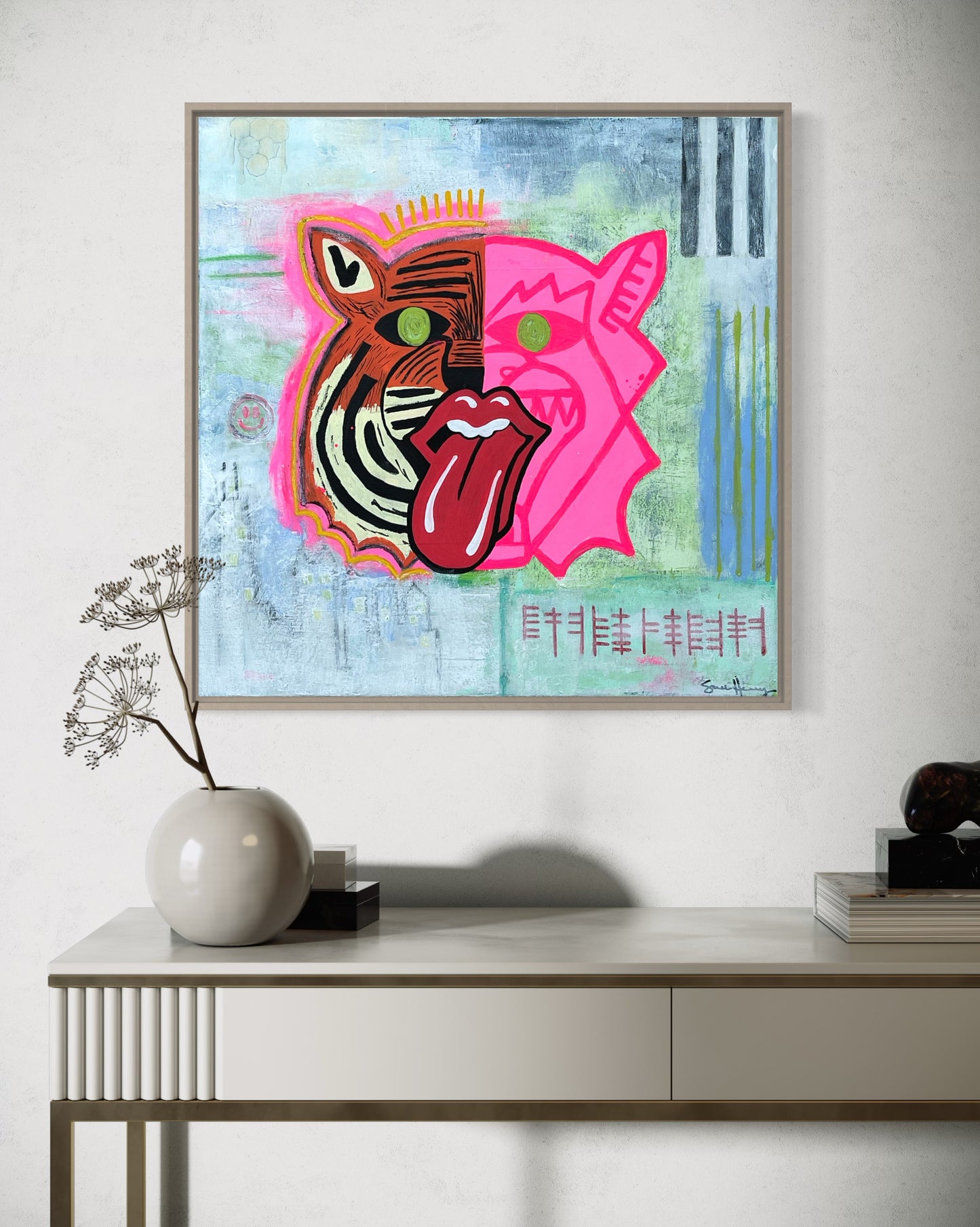The painting titled Chewing Consciousness Into Pieces Original Painting by Sarah Henry Art shown hanging on a white wall above a white console table with minimalist home decor.