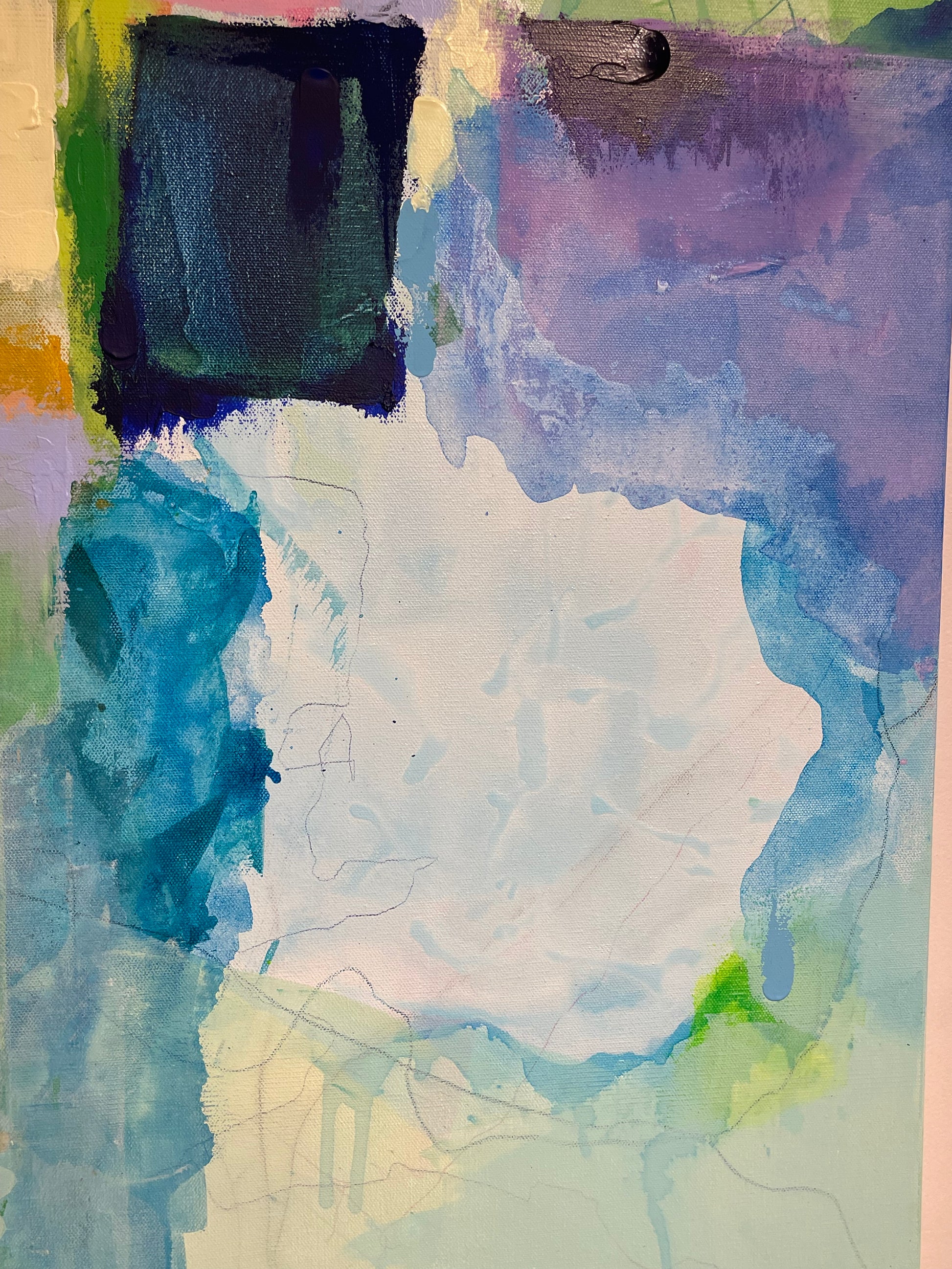 Abstract watercolor painting with various colors on a textured surface
