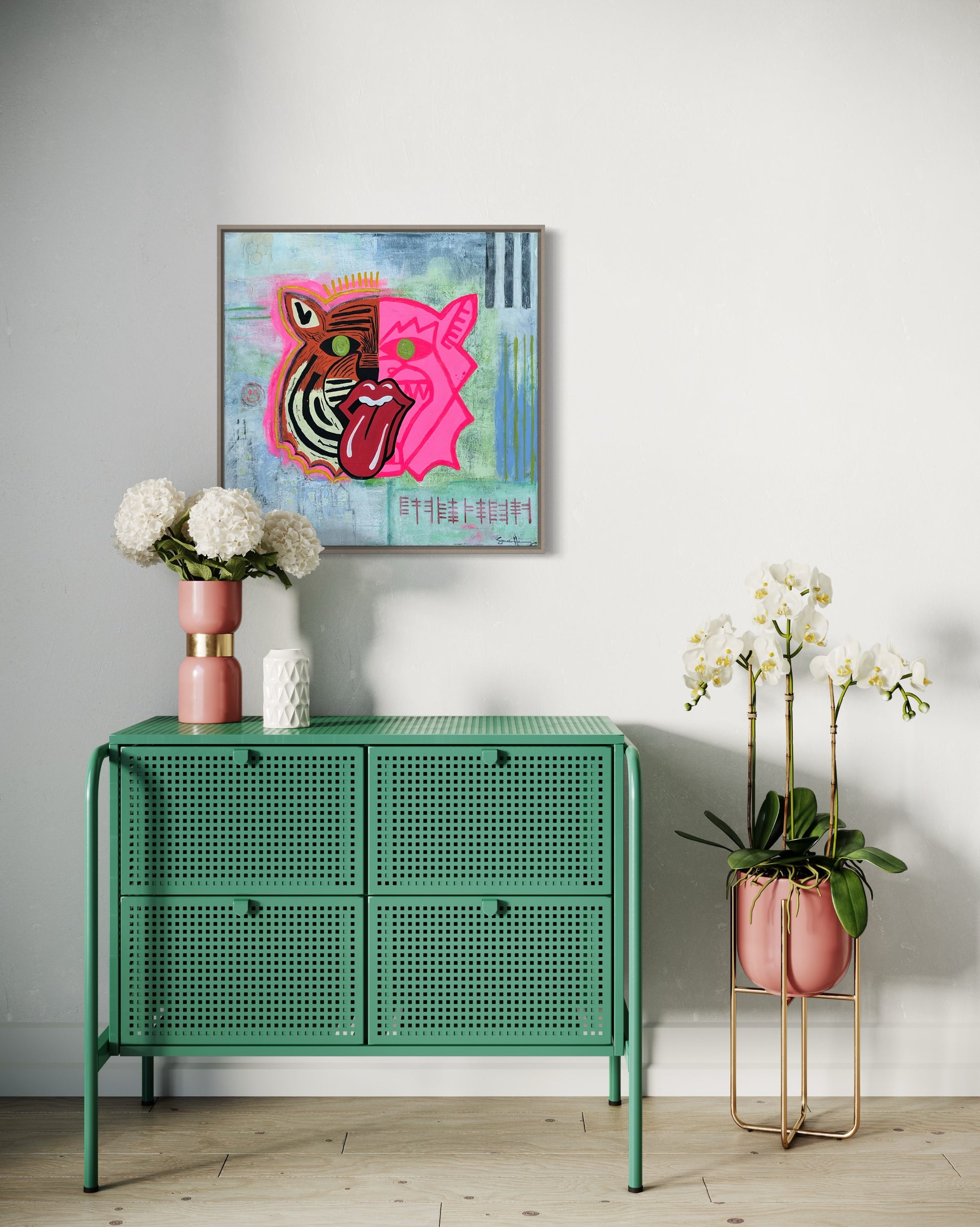 A 20 inch by 20 inch affordable abstract expressionist original painting by Sarah Henry Art featuring a dual faced tiger, one side orange the other pink, with a honey comb, black and white stripes, the Chicago skyline, a smiley face, and ogham writing stating not silenced hangs on a white wall in a bedroom.