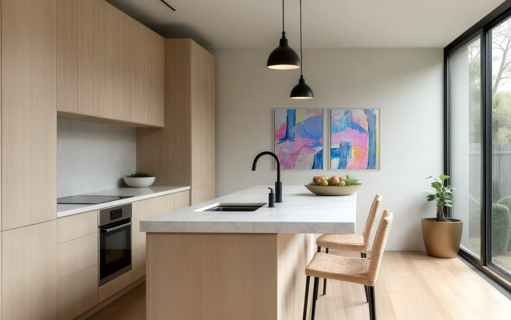 "Palm Beach " is a diptych of abstract paintings featuring soft, layered strokes in shades of pink, blue, and yellow. The compositions include geometric and organic shapes with subtle linear details, creating a harmonious and modern aesthetic. This affordable coastal grand millennial decor hangs in a minimalist kitchen.