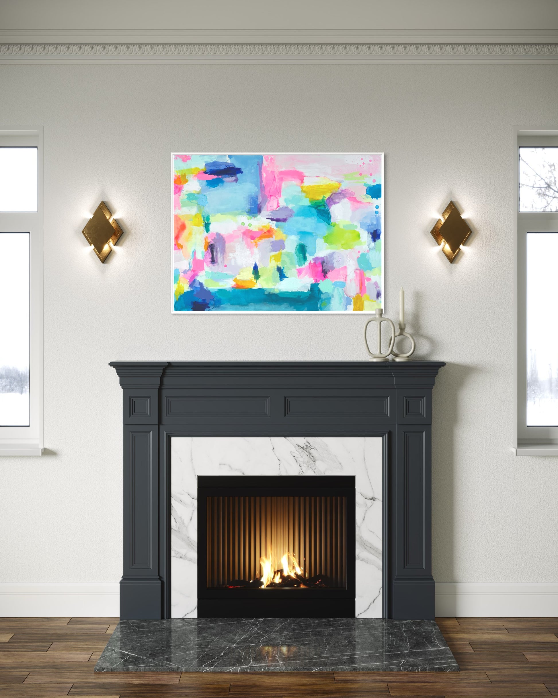 The Dolly Original Abstract Painting by Sarah Henry as part of the Happy Art Collection, shown on a gray wall with detailed crown molding hanging above a dark gray fireplace with white marble and two bronze light sconces.