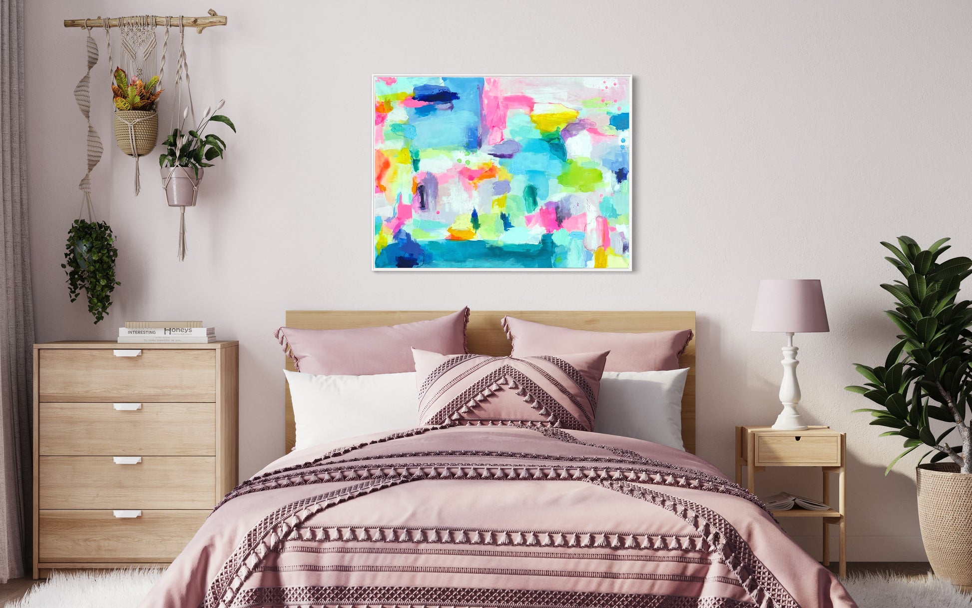The Dolly Original Abstract Painting by Sarah Henry shown on a pale pink wall in a girl's bedroom with light wood furniture, pink bedding, a pink and white lamp, and hanging green plants