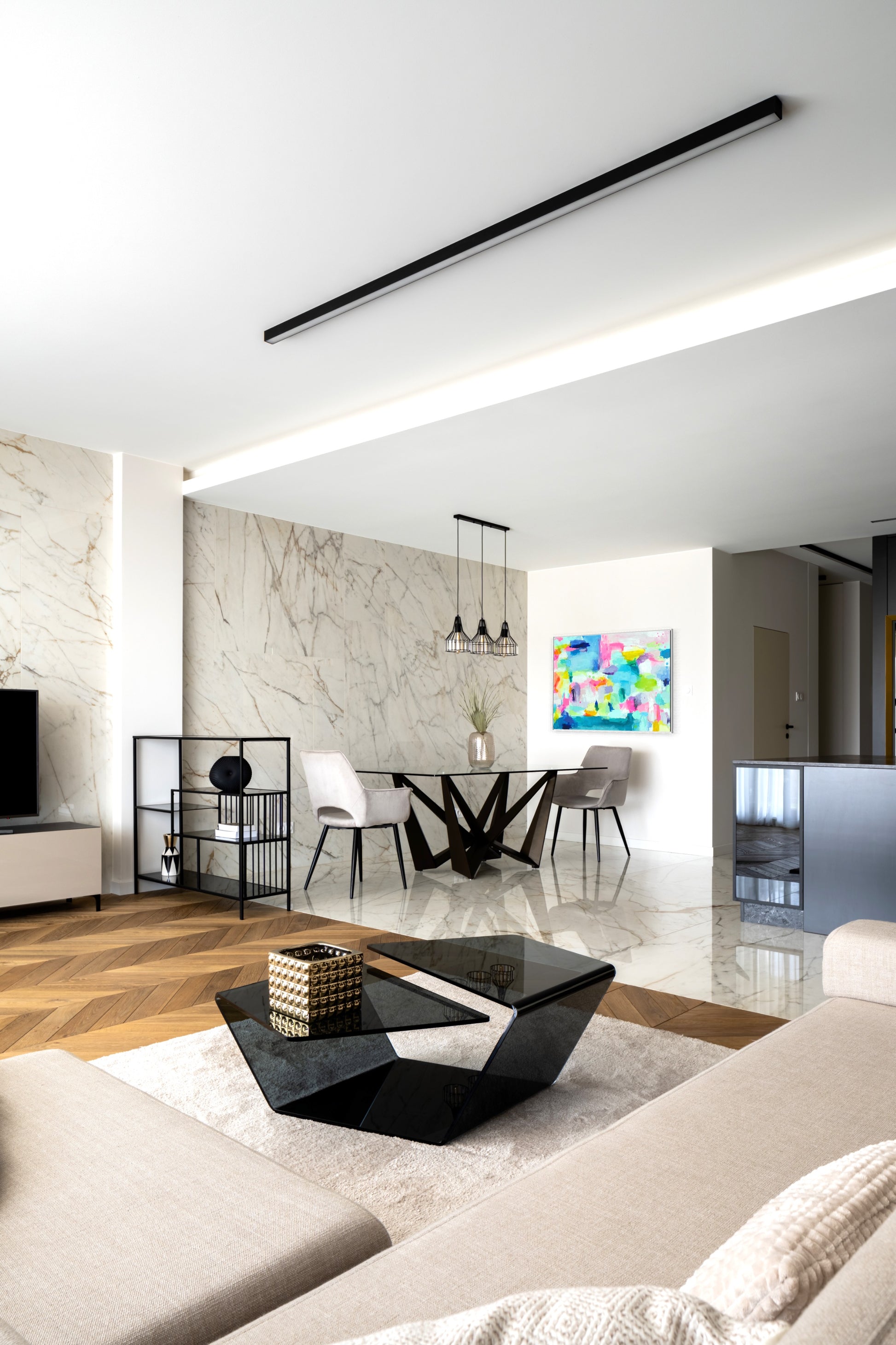 The Dolly Original Abstract Painting by Sarah Henry shown in a modern condo apartment hanging on a white wall in the dining area adjacent to a marble slab wall.