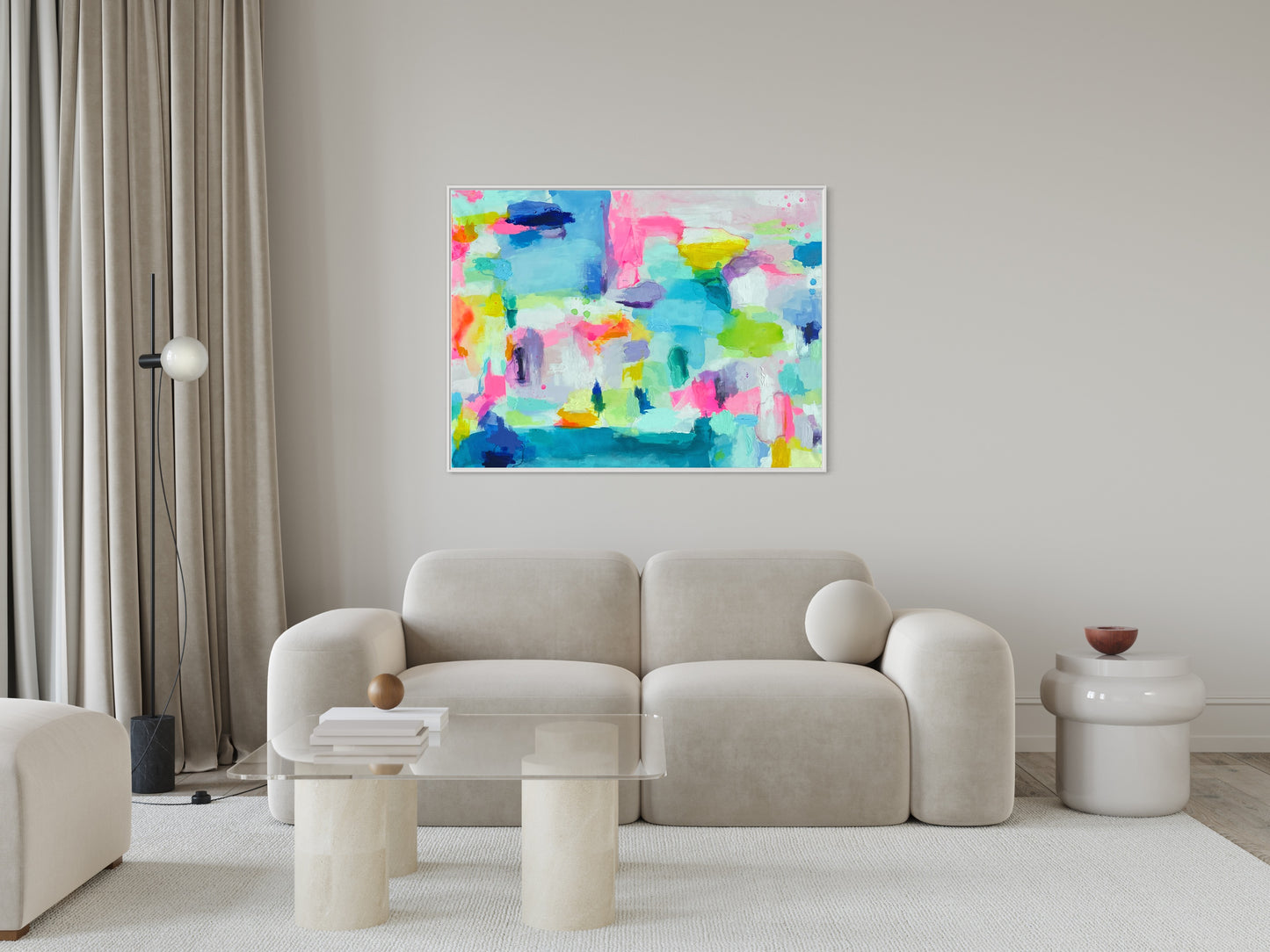 The Dolly Original Abstract Painting by Sarah Henry shown in a monochromatic white living room with a cloud white sofa, a concrete and glass coffee table, and a white acrylic side table.