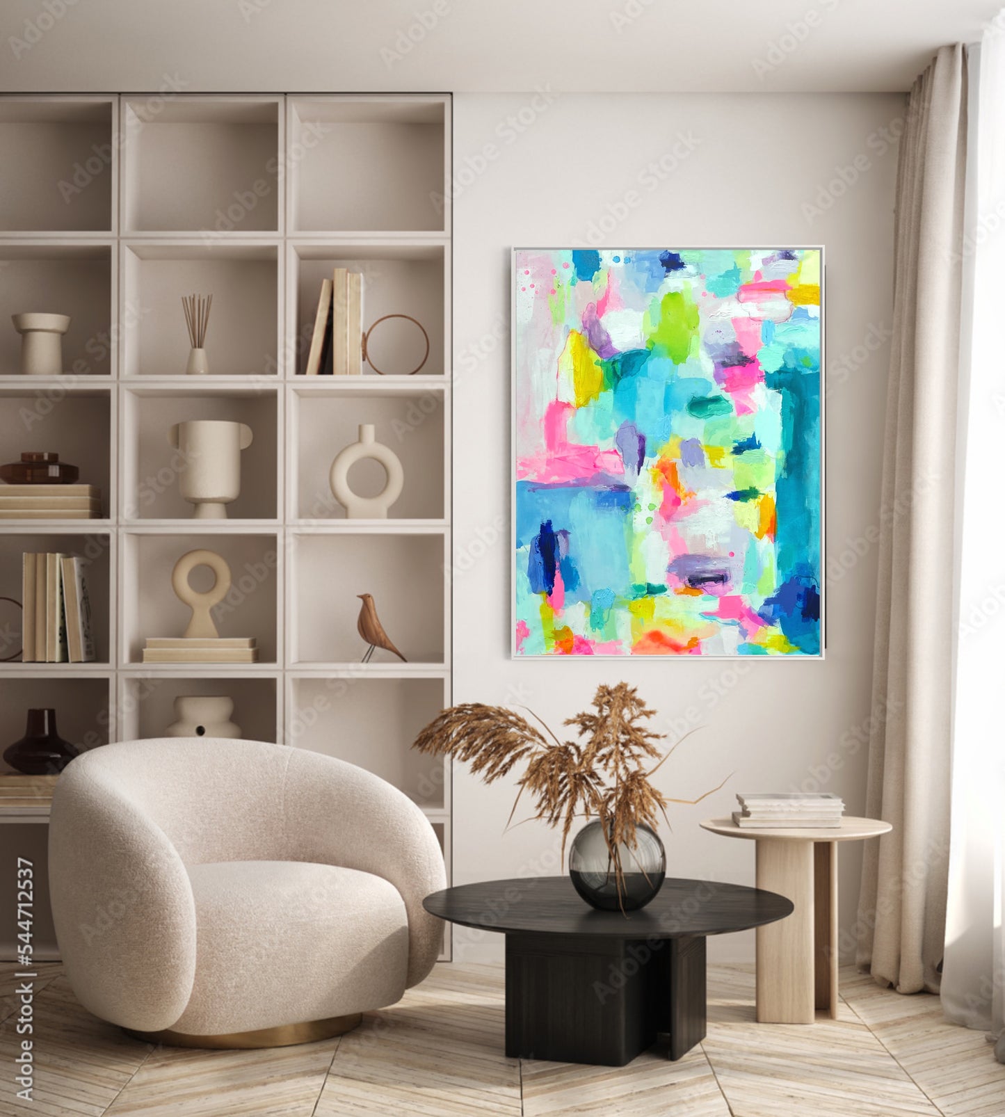 The Dolly Original Abstract Painting by Sarah Henry as part of the Happy Art Collection, shown hanging vertically in a modern minimalist room with a white fabric club chair, a black marble table, and a built in bookcase showing mostly white, monochromatic wall decor.