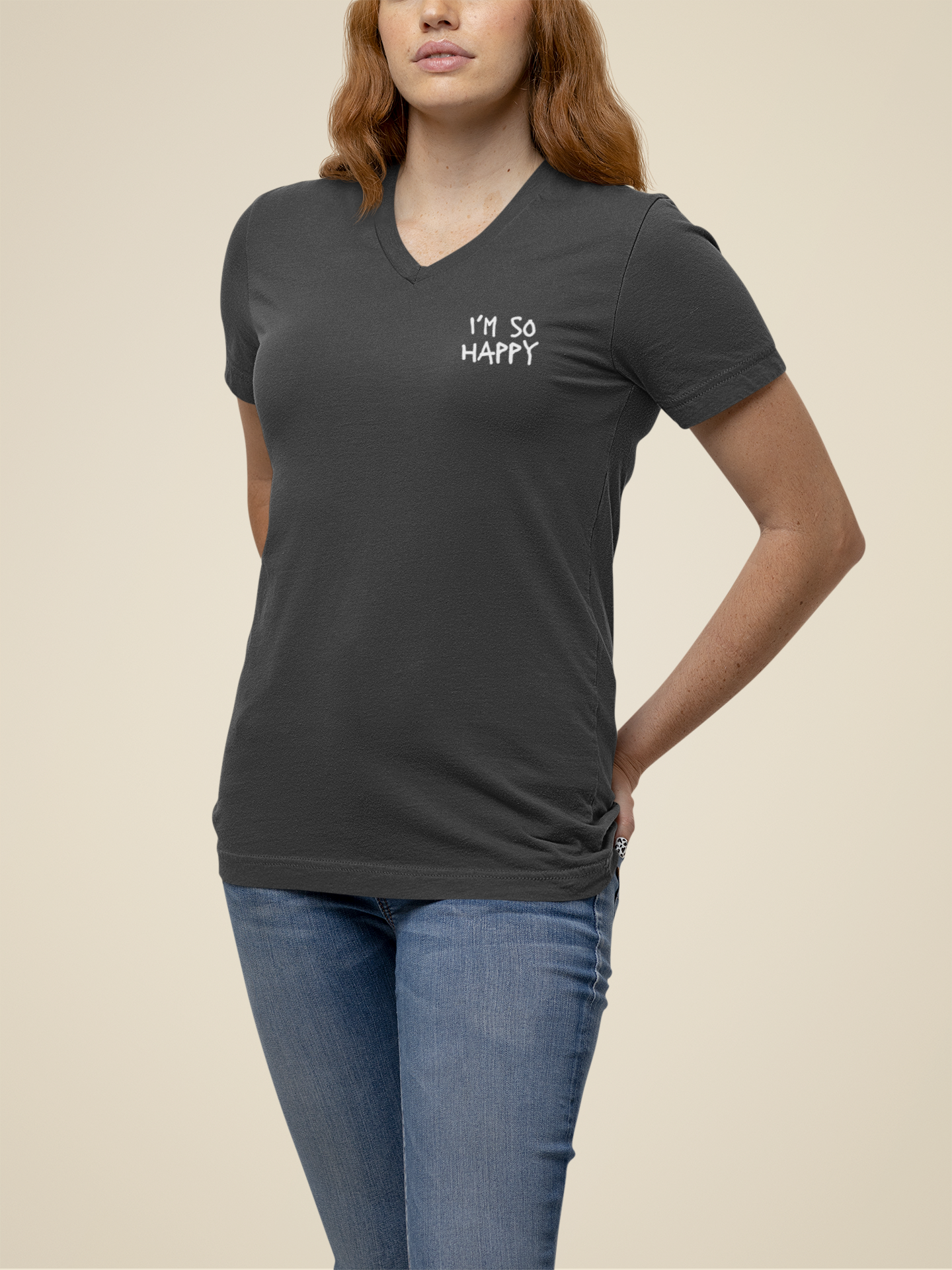 Unisex V-neck Nirvana shirt in gray, featuring the phrase 'I'm So Happy' with a smiley face graphic and text shown on the front.