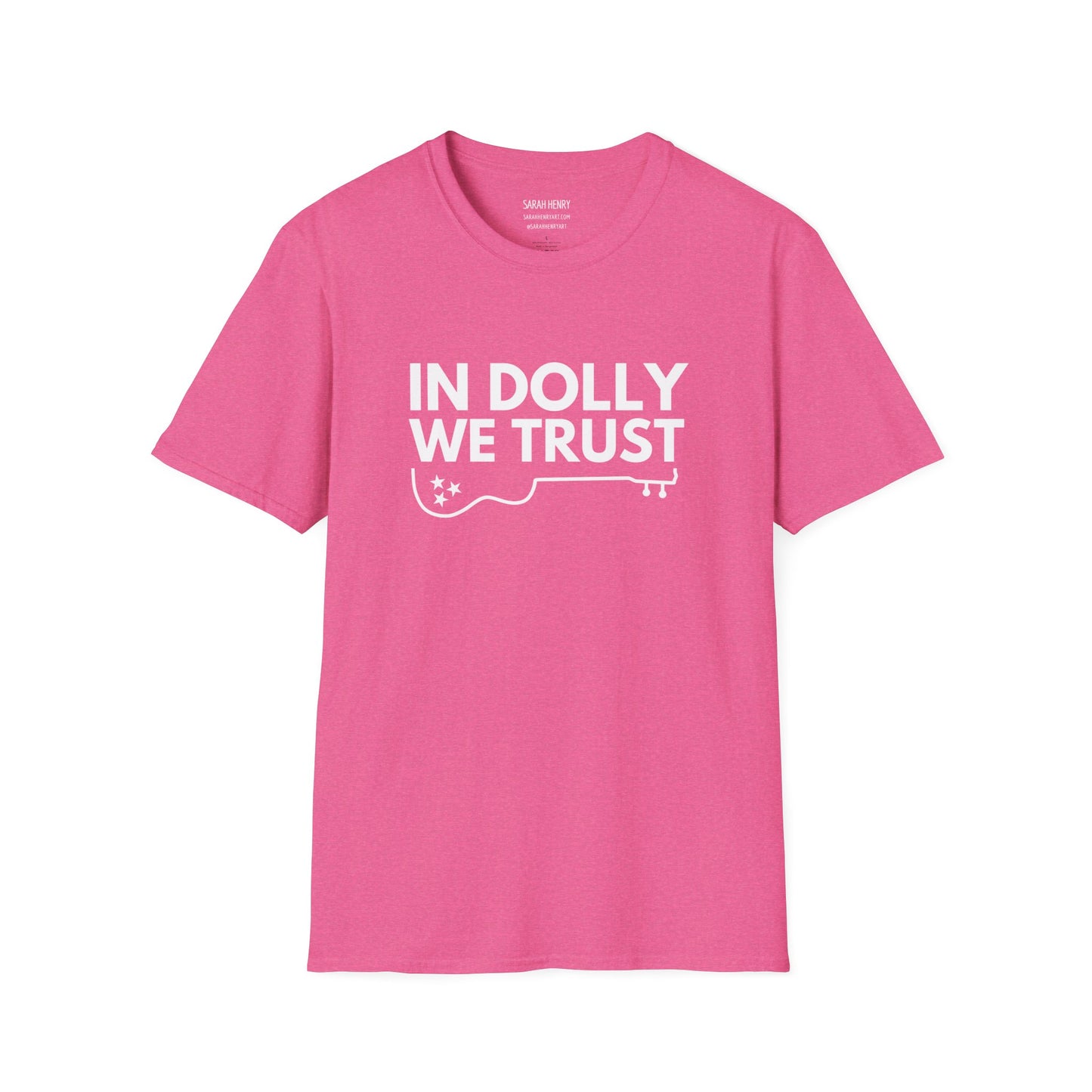 A pink dolly parton shirt with pink letters saying In Dolly We Trust