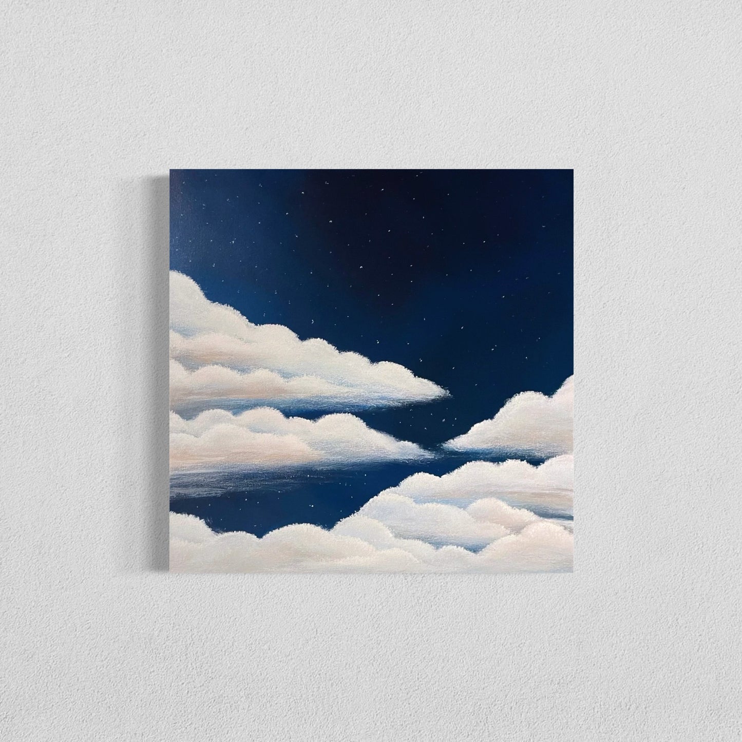 Dreamy cloudscape painting under a navy blue starry night sky