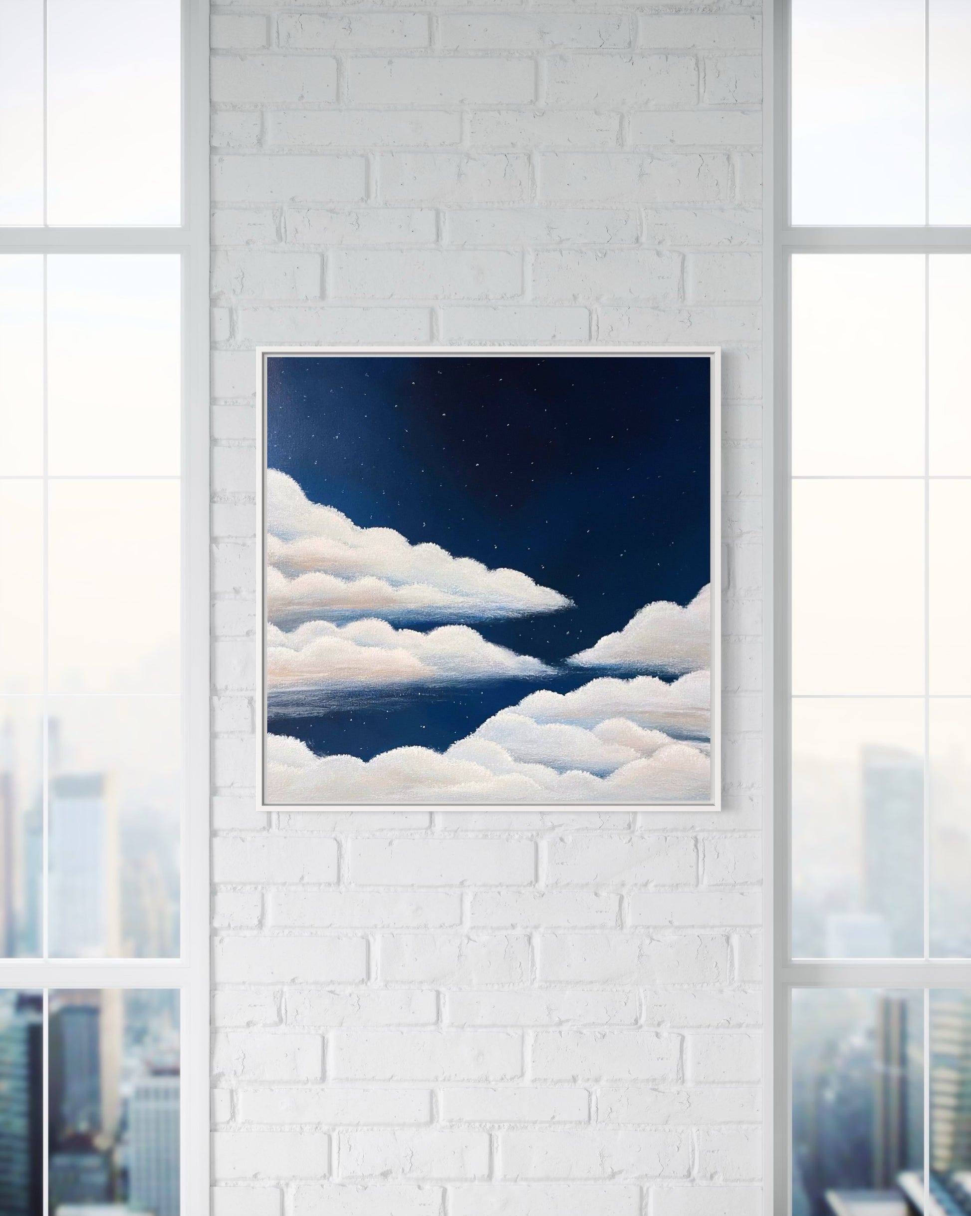 Dreamy cloud painting under a navy blue starry night sky on a white brick wall in a nyc high rise gallery