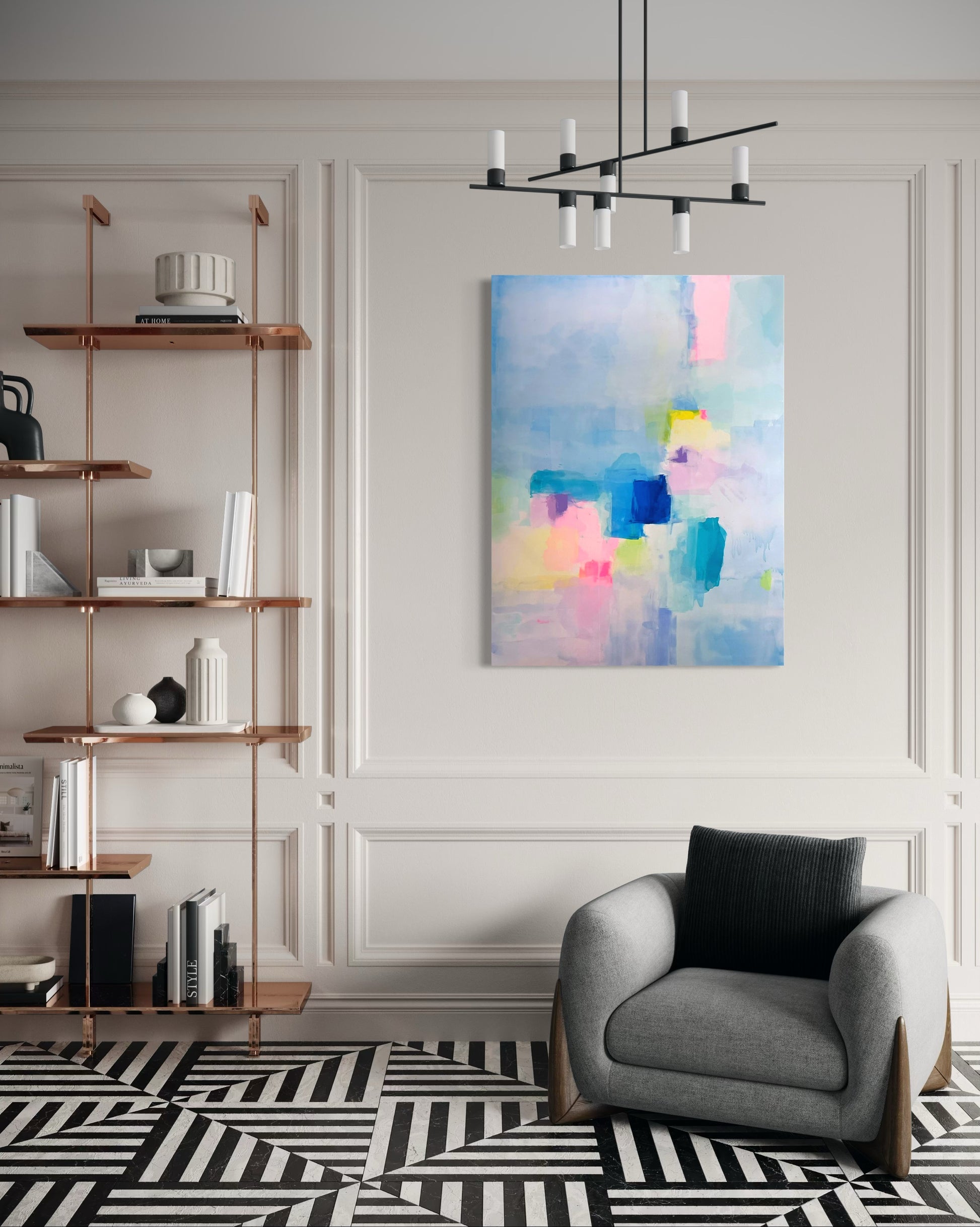 Modern living room with contemporary abstract painting, bookshelf, and armchair.