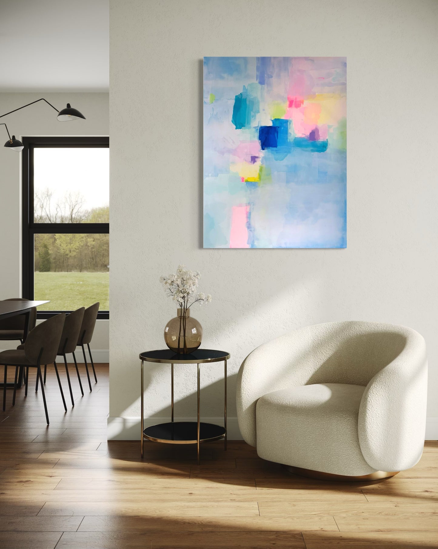 Modern living room with a white armchair, preppy grand millennial abstract painting, and dining area.