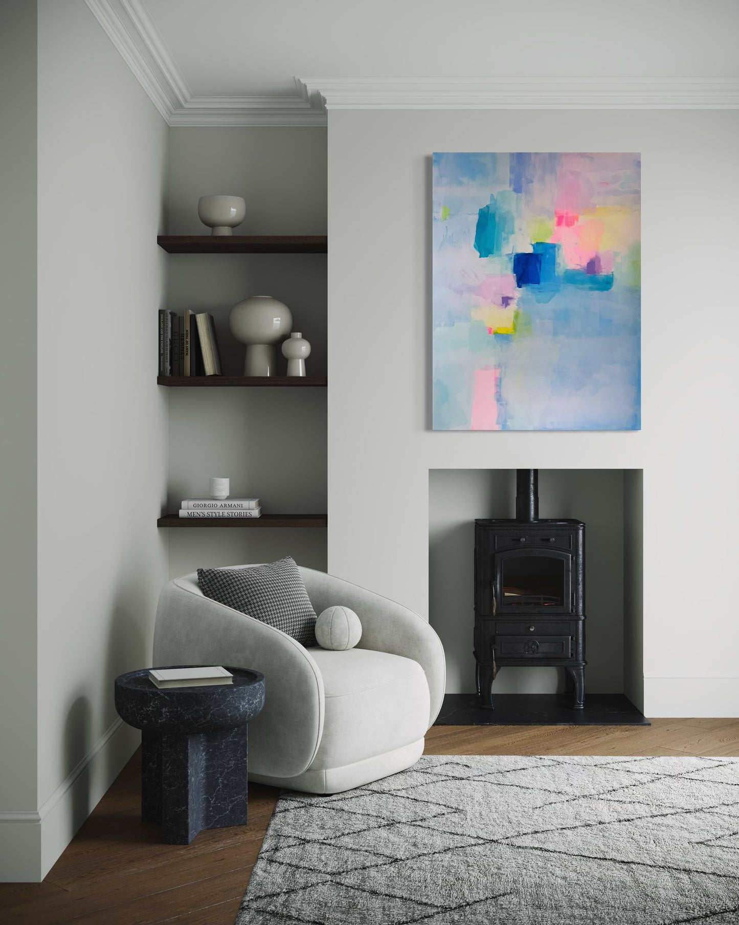 Modern living room with a white armchair, abstract painting, and fireplace.