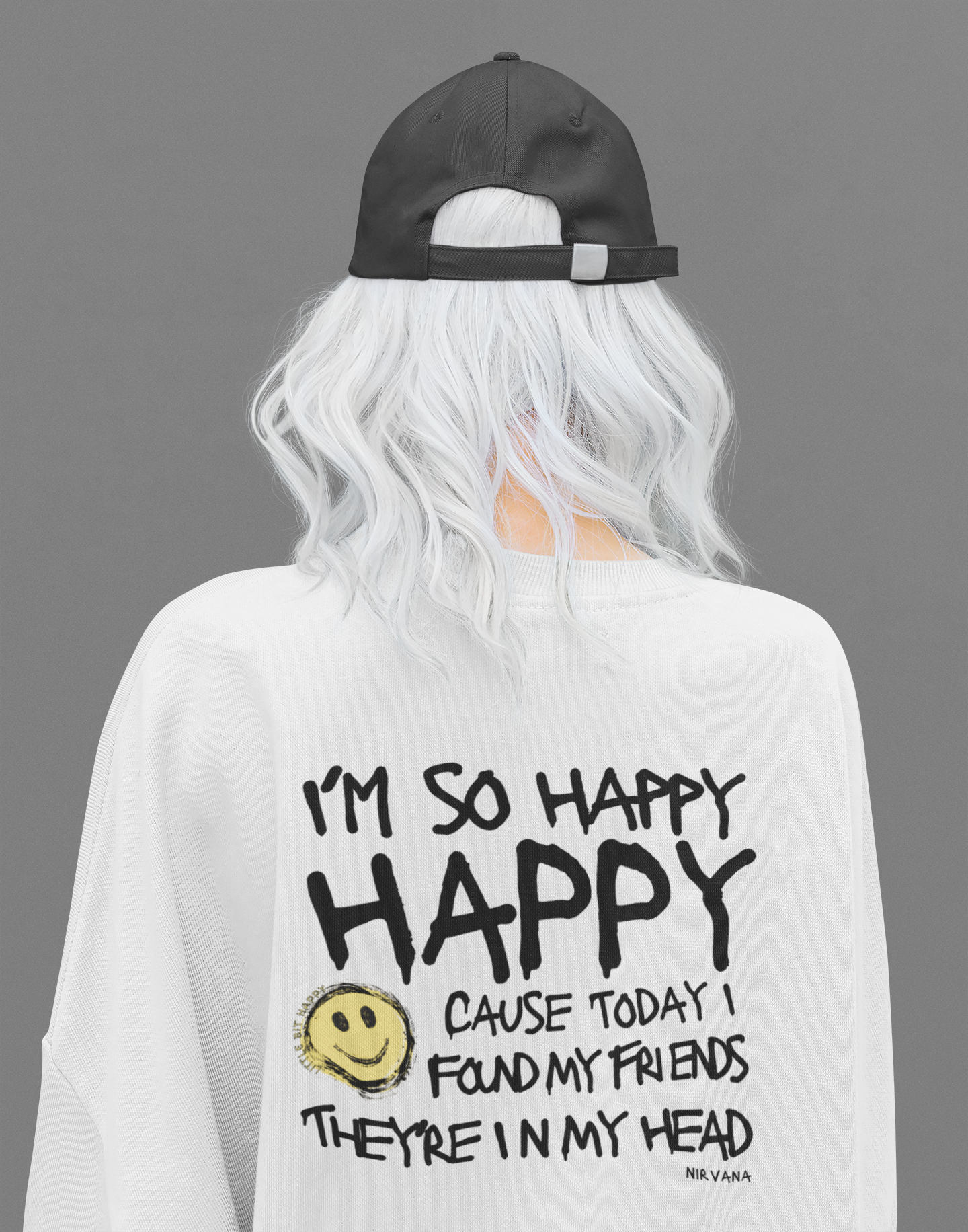 Nirvana Sweatshirt with Im So Happy Lyrics on back, worn by a white woman with white hair and a black baseball hat.