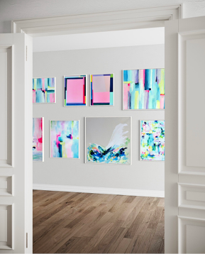 A modern interior featuring abstract wall art gallery with a collection of vibrant, abstract paintings in pastel pink, blue, and yellow hues. 