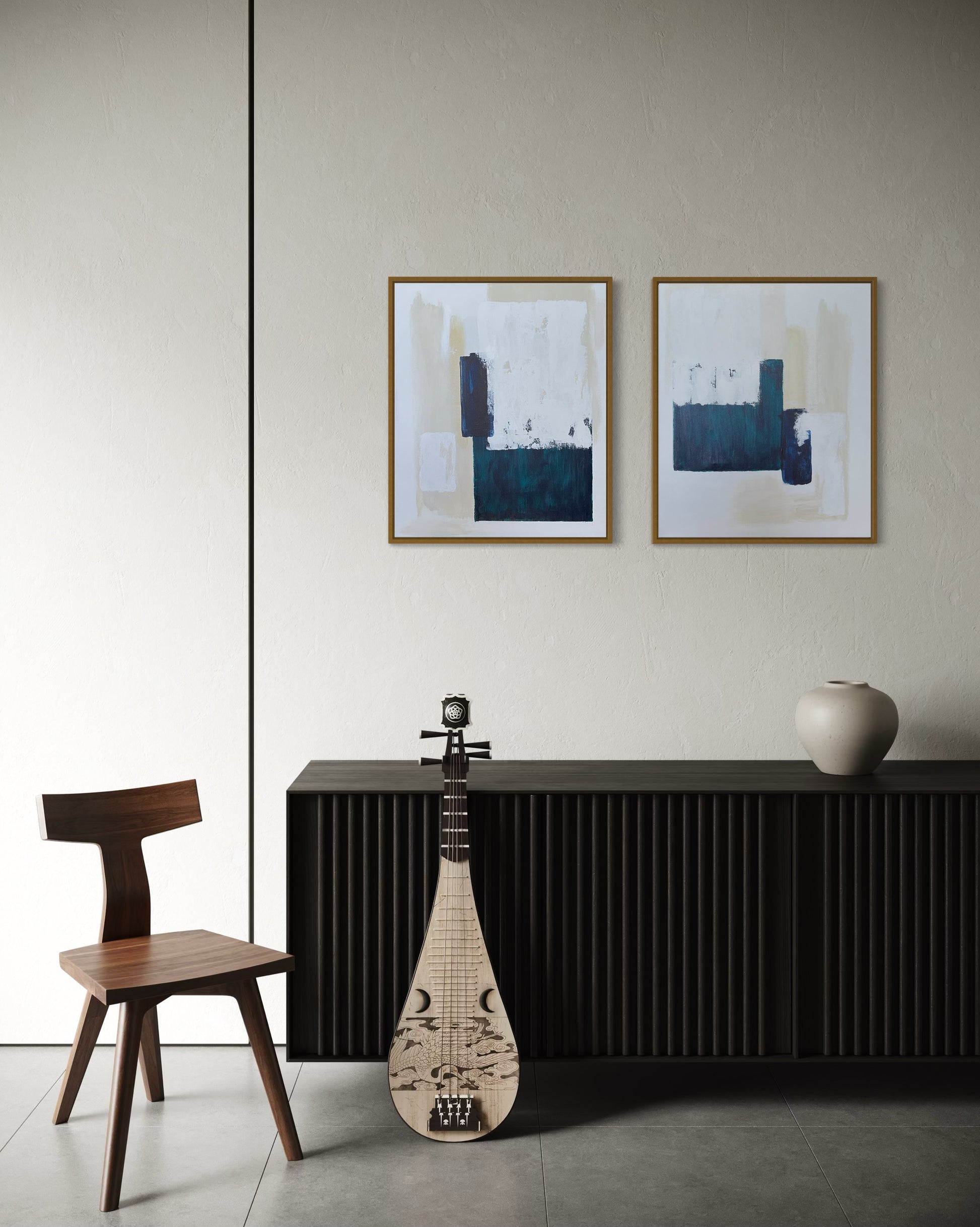 Modern interior with a black console table, wooden chair, and white cream and turquoise abstract diptych wall art.